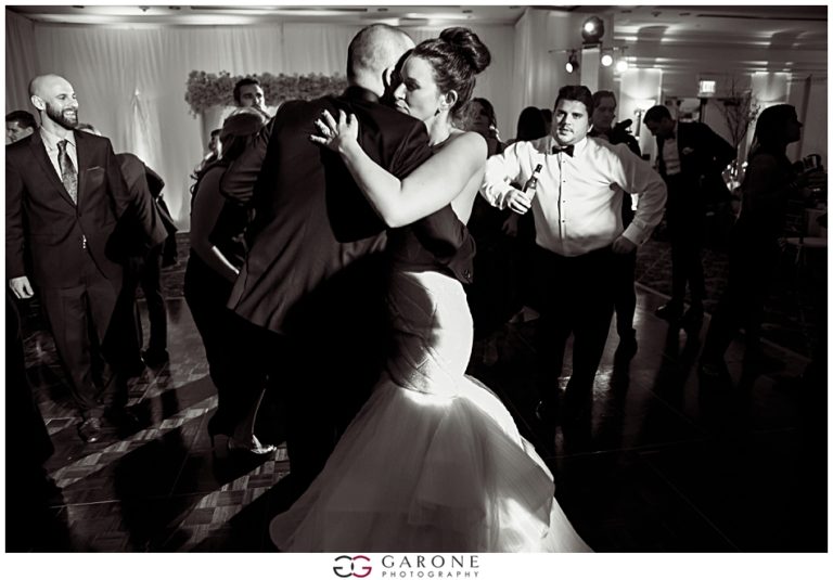 A couple shares a romantic dance at their wedding reception.
