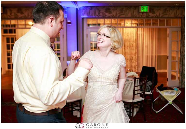 A joyful couple dancing together at a wedding reception.