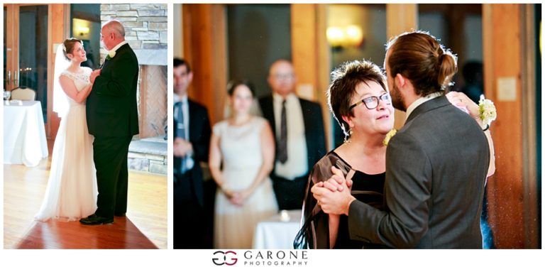 A bride and groom dance with family at a wedding reception.