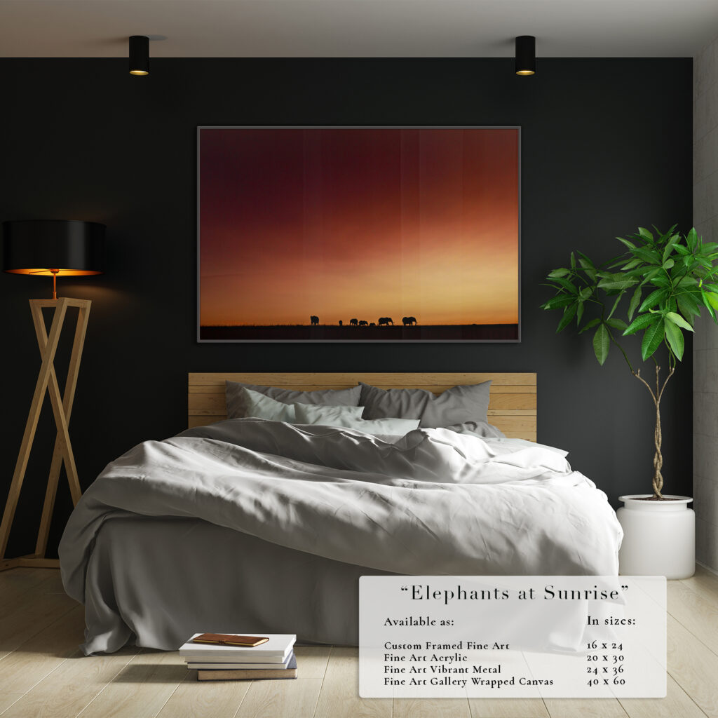 Cozy bedroom with a sunset cityscape photo on a dark wall.